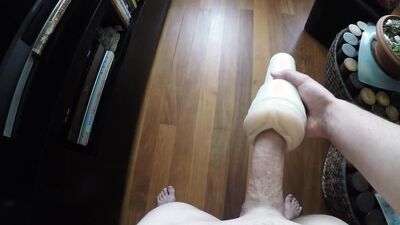 Horny guy is pushing his hard cock in flashlight sex toy