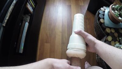 Horny guy is pushing his hard cock in flashlight sex toy