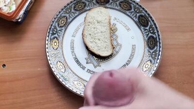 Horny man is jerking off and jizzing on that piece of bread
