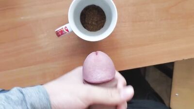 Kinky chum is jerking off and jizzing in a coffee cup