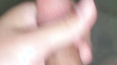 Horny dude is filming his cock under the shower while jerking off