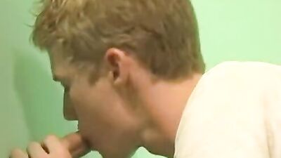 Twink sucks a dick and gets fucked thorough a gloryhole
