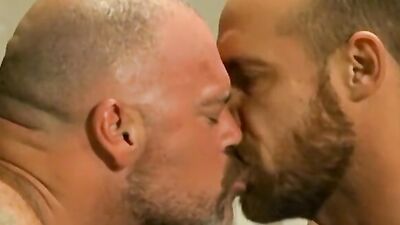 Bald man sucks one cock while the other one is drilling him