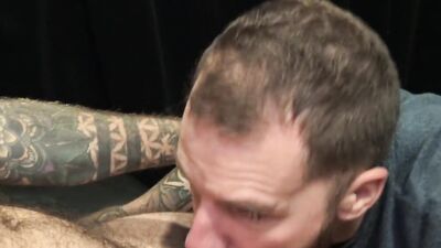 Bearded man shows a lot of talents while polishing that hard cock