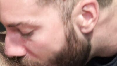 Bearded man shows a lot of talents while polishing that hard cock