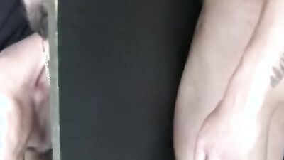 Gay dudes sucks a hard cock thorough a hole on the wall