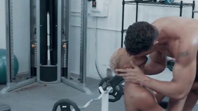 Blonde black guy is poked in the butt by his white gym mate