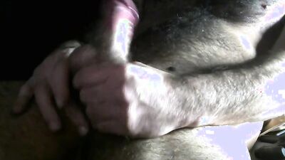 Amateur bear is stroking his prick in front of the camera