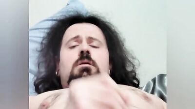 Straight bearded bloke is filming himself while stroking a cock