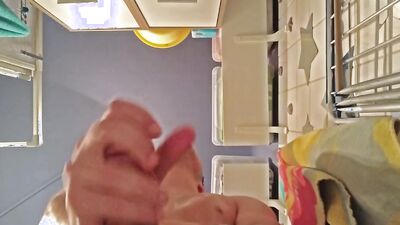 Oily amateur chap is stroking his cock in the bathroom