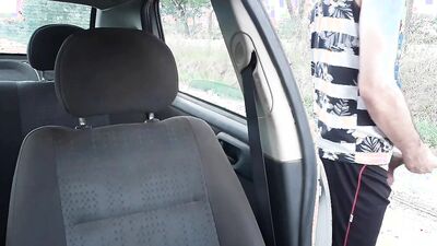 Amateur chap is jerking his cock in front of his car