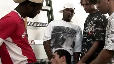 Latino goes on his knees to suck dicks and get loads of cum