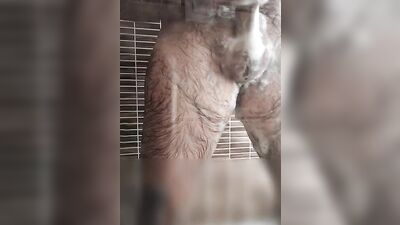 Hairy dude takes a relaxing shower and strokes his dick
