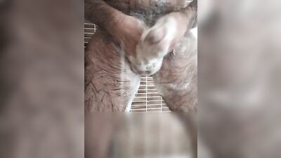 Hairy dude takes a relaxing shower and strokes his dick