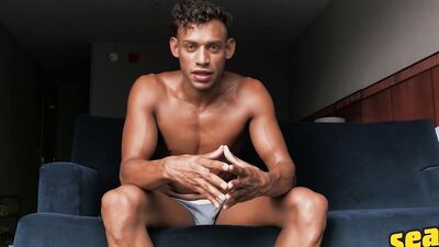 Fit black guy strips and tugs on his massive dick