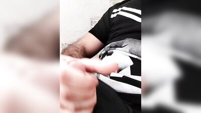 Hairy dude pulls his fat dick out of a skimpy shorts