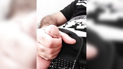 Hairy dude pulls his fat dick out of a skimpy shorts