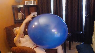Older guy blows big balloons up and fucks them hard