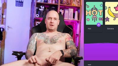 Tattooed and bald guy jerks off solo and uses toys