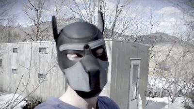 Cute dude with a wolf mask films himself talking outdoors