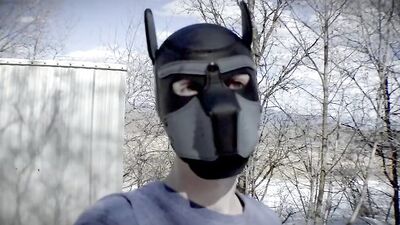 Cute dude with a wolf mask films himself talking outdoors