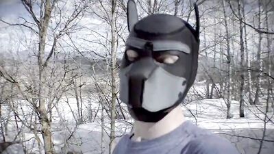 Cute dude with a wolf mask films himself talking outdoors