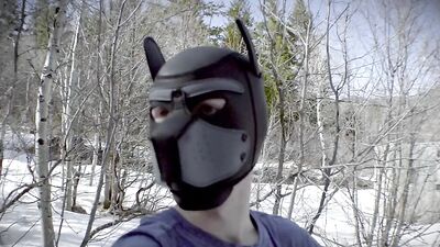 Cute dude with a wolf mask films himself talking outdoors
