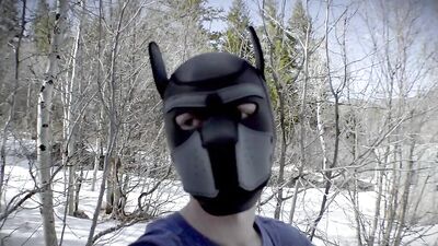 Cute dude with a wolf mask films himself talking outdoors