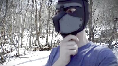 Cute dude with a wolf mask films himself talking outdoors