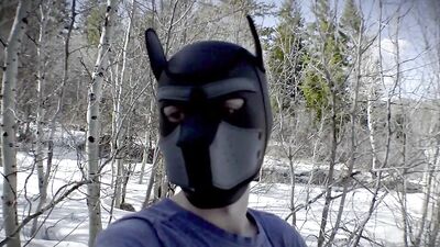 Cute dude with a wolf mask films himself talking outdoors