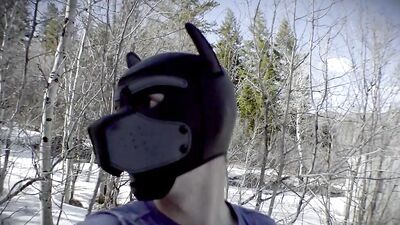 Cute dude with a wolf mask films himself talking outdoors