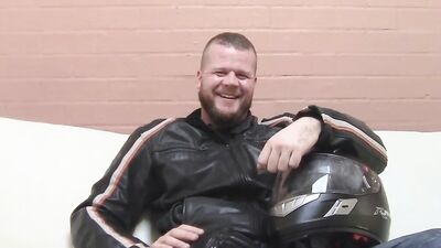 Buff biker takes his clothes off and masturbates with a toy