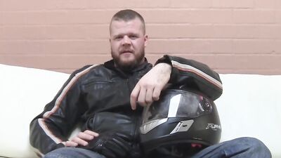 Buff biker takes his clothes off and masturbates with a toy