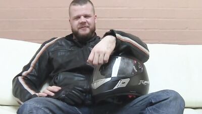 Buff biker takes his clothes off and masturbates with a toy
