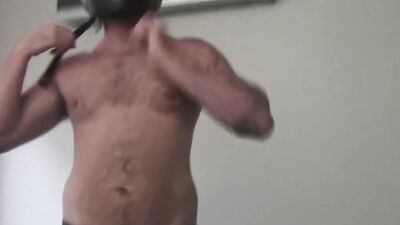 Buff biker takes his clothes off and masturbates with a toy