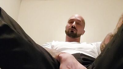 Bald stud fingers his tight asshole while jerking off solo