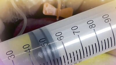 Perverted guy injects saline in his scrotum to make it larger
