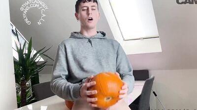 Naughty twink carves a Halloween pumpkin to fuck it passionately