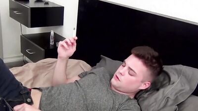 Young guy takes his clothes off and masturbates while smoking