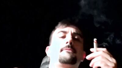 Horny stud takes his cock out and jerks off while smoking