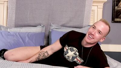 Dashing jock fingers his ass and strokes his throbbing cock