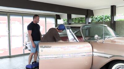 Buff hunk sucked off by a twink in a car salon before fucking