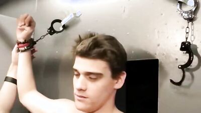 Attractive jock tied up and restrained to have his fat dick sucked