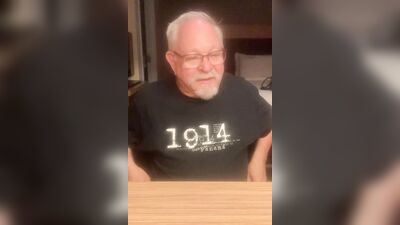 Chubby older guy with glasses strips and strokes his cock