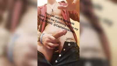 Striking stud in a sexy outfit strokes his massive cock