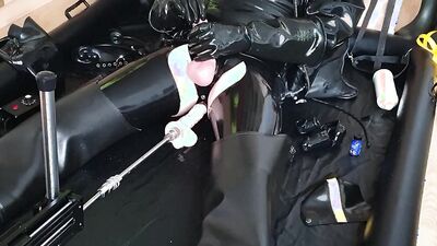 Perverted dude in a leather outfit drills his ass with a fucking machine
