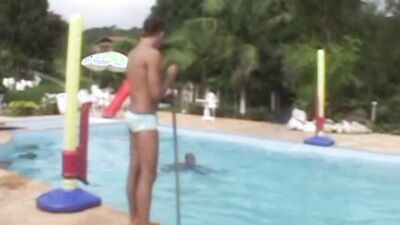 Muscular hunk fucks a guy by the outdoor pool after blowjobs