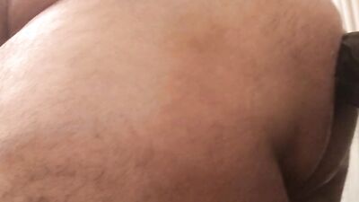 Fat guy sticks a big dildo to a wall and rides it