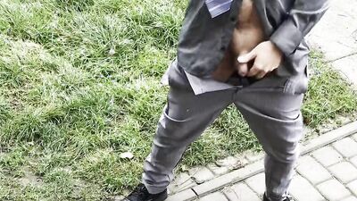Handsome hunk in a shirt and tie plays with a dildo