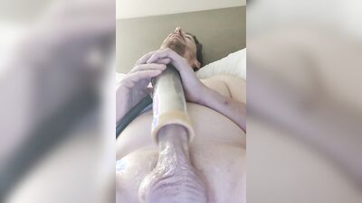 Stud uses a kinky sex toy to stroke his big cock